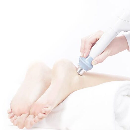 shockwave therapy on patient ankle